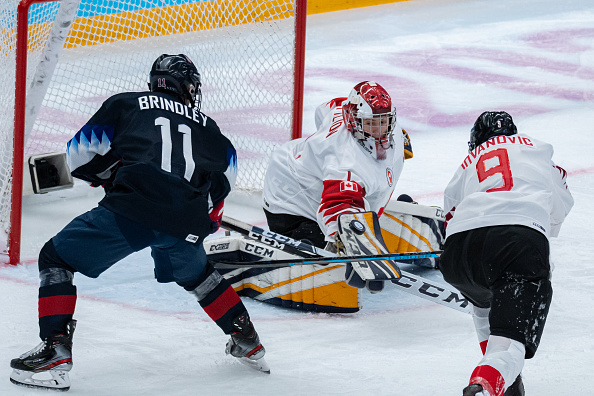 Gavin Brindley, one of Gabe Foley's Top 30 Americans in the 2023 NHL Draft, fights for the puck in front of the net.